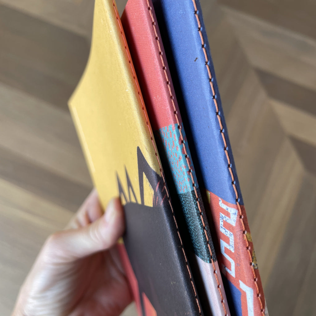 lomo de 3 cuadernos con diseños 